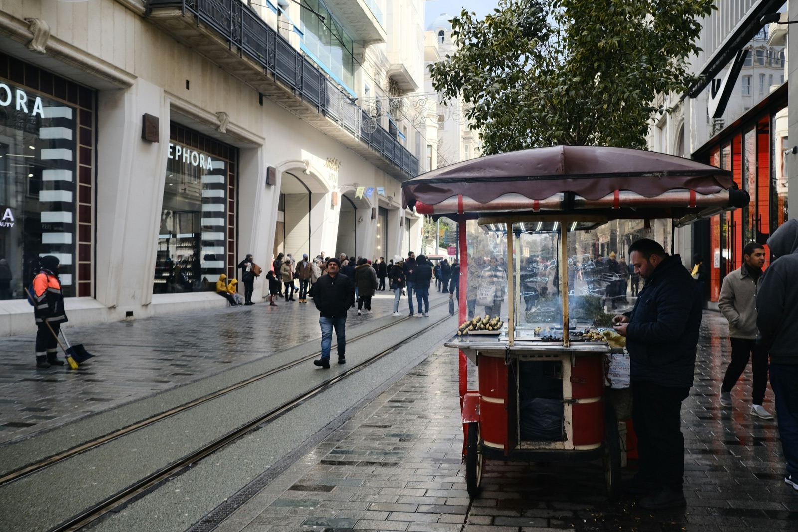 Street market vendor serving a local neighborhood
