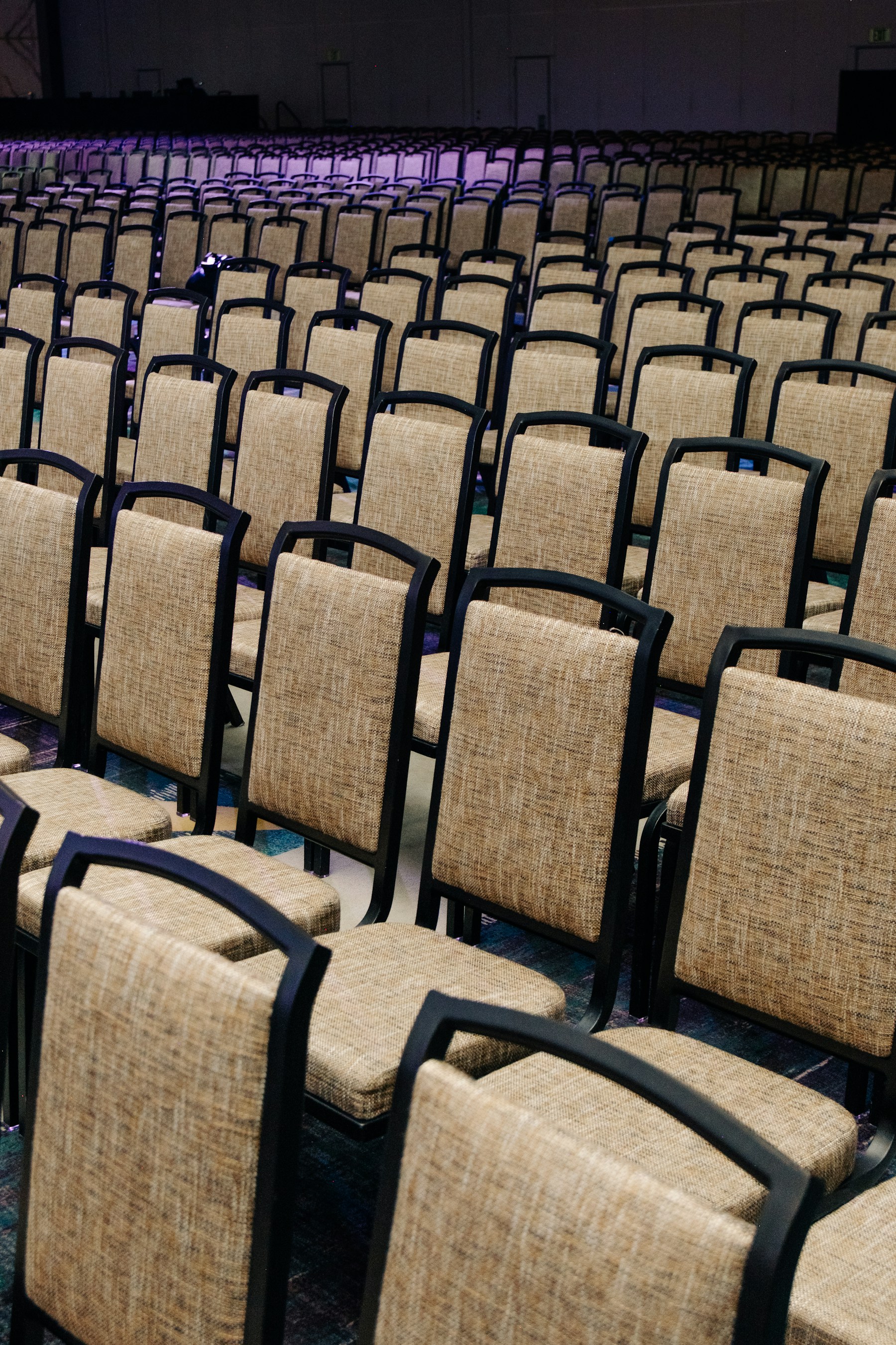 Rows of empty conference seats waiting for attendees